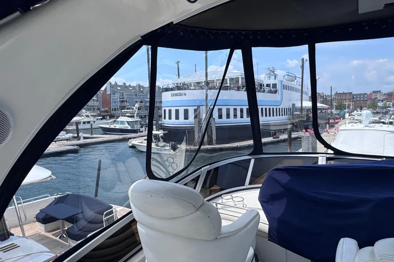Slide: The Image of Interior view of a 2006 Sea Ray 44 Sedan Bridge yacht docked at a marina. - 32