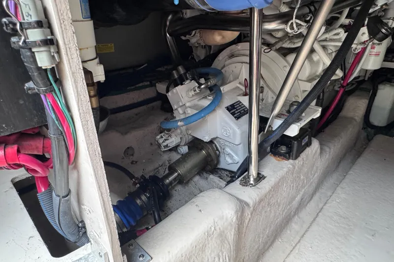 Slide: The Image of Engine room of a 2006 Sea Ray 44 Sedan Bridge with visible mechanical components. - 46