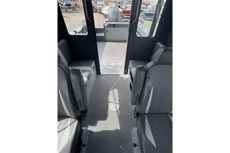 Slide: The Image of 2024 Hewescraft 240 Ocean Pro Hardtop interior with gray seating and spacious layout. - 7