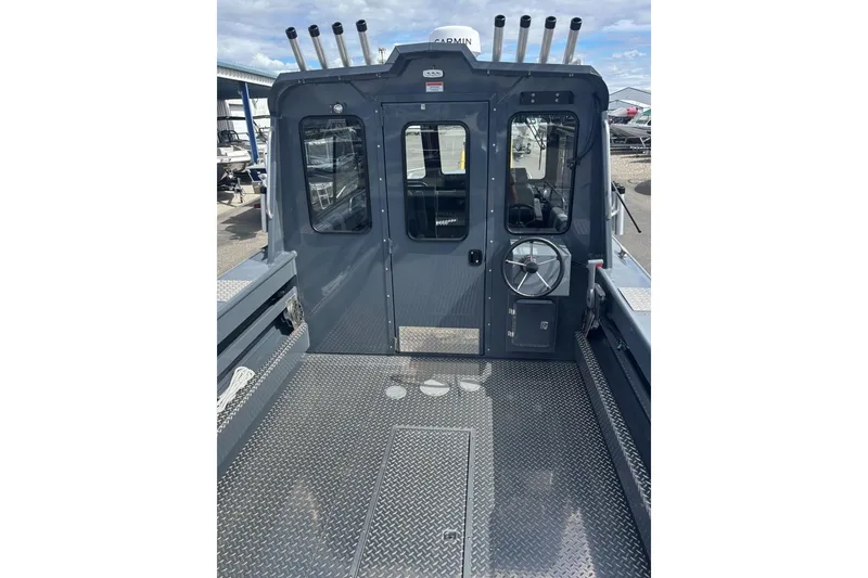 Slide: The Image of 2024 Hewescraft 240 Ocean Pro Hardtop boat with metal deck and rod holders. - 3