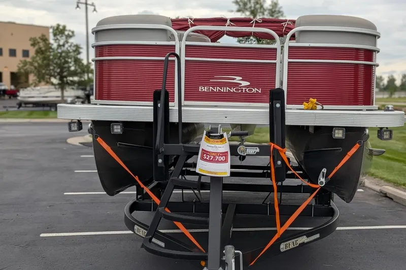Slide: The Image of 2021 Bennington 205SL pontoon boat for sale, red exterior, priced at $27,700. - 5