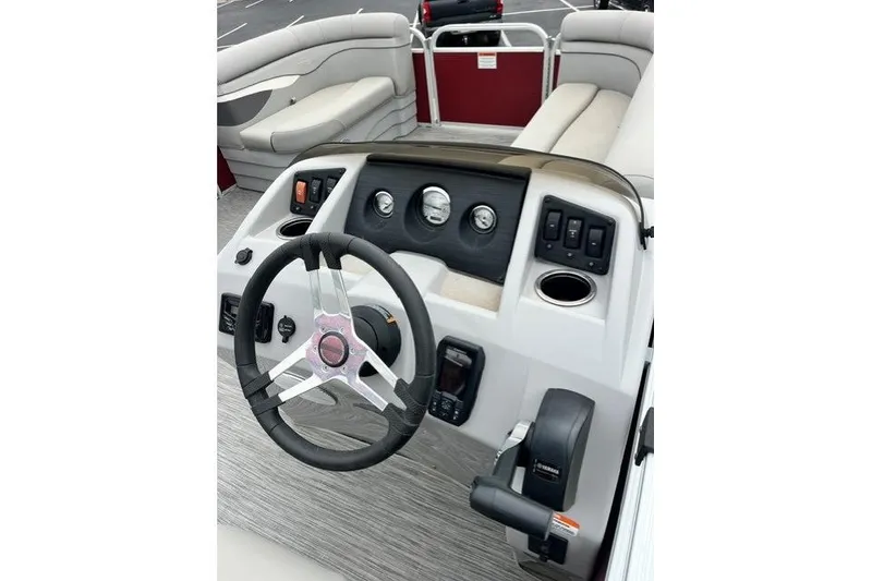 Slide: The Image of 2021 Bennington 205SL boat dashboard with steering wheel and control panel. - 10