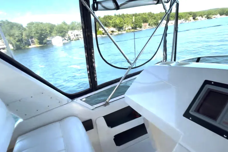 Slide: The Image of Interior view of 1997 Carver 355 Aft Cabin Motor Yacht on a scenic lake. - 14