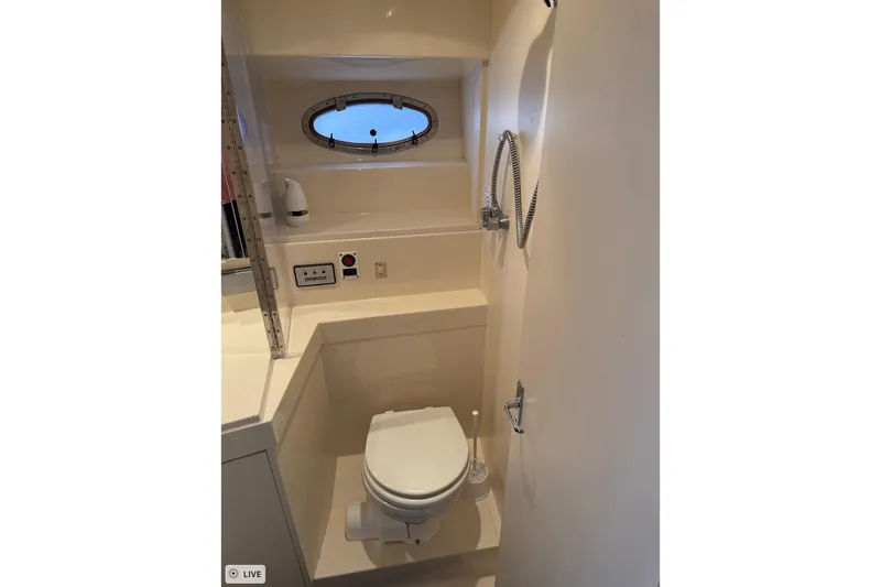 Slide: The Image of Bathroom interior of 1997 Carver 355 Aft Cabin Motor Yacht with porthole window. - 22