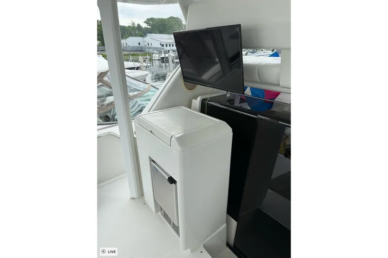 Slide: The Image of 1997 Carver 355 Aft Cabin Motor Yacht interior with TV and storage unit. - 15