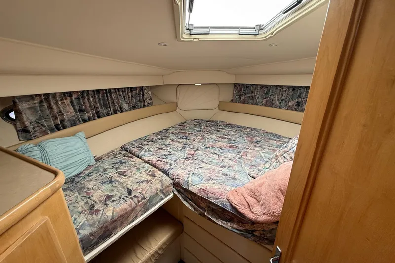 Slide: The Image of Interior cabin of 1997 Carver 355 Aft Cabin Motor Yacht with patterned bedding. - 12