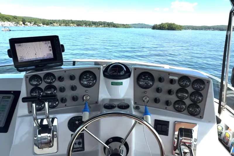 Slide: The Image of Cockpit view of 1997 Carver 355 Aft Cabin Motor Yacht with navigational instruments. - 10