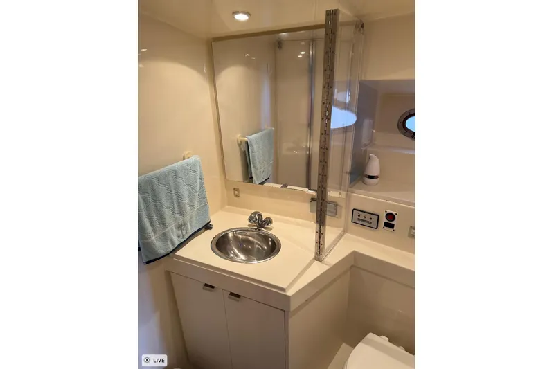 Slide: The Image of Bathroom interior of 1997 Carver 355 Aft Cabin Motor Yacht with sink and mirror. - 18