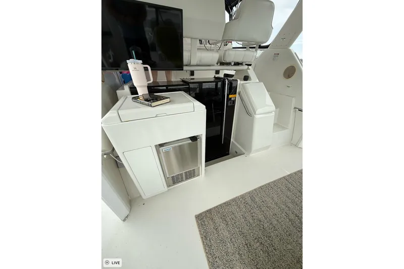 Slide: The Image of Interior of 1997 Carver 355 Aft Cabin Motor Yacht with seating and mini fridge. - 8
