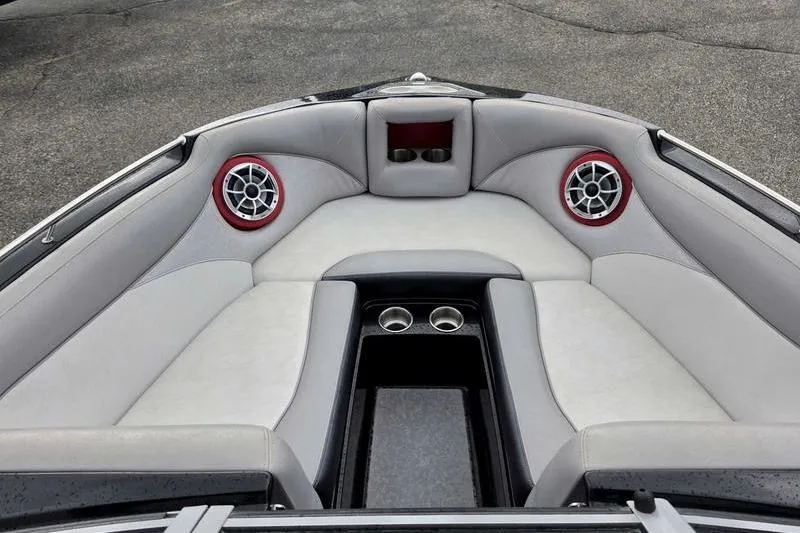 Slide: The Image of Interior of 2012 Centurion Enzo SV233 boat with gray seating and red speaker accents. - 10