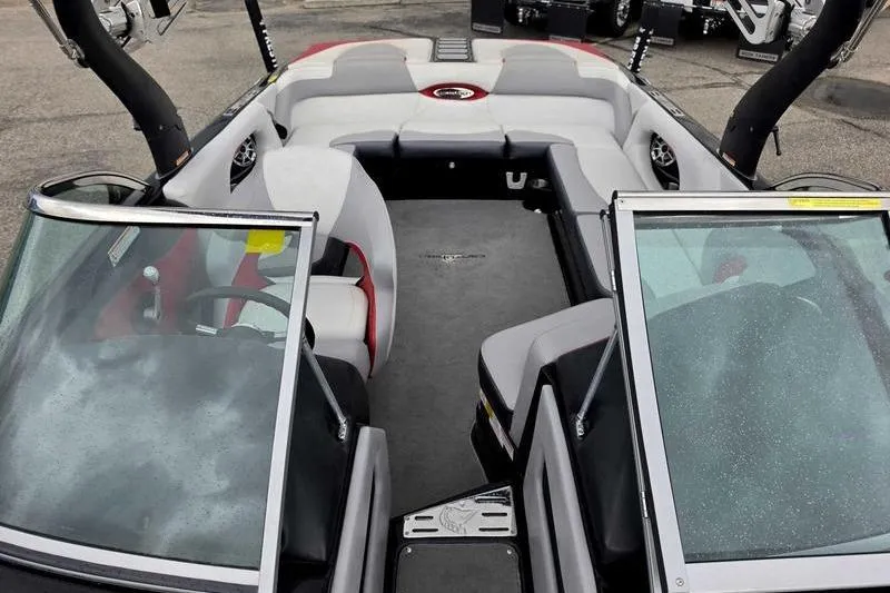 Slide: The Image of 2012 Centurion Enzo SV233 boat interior with gray and red seating, open windshield. - 12