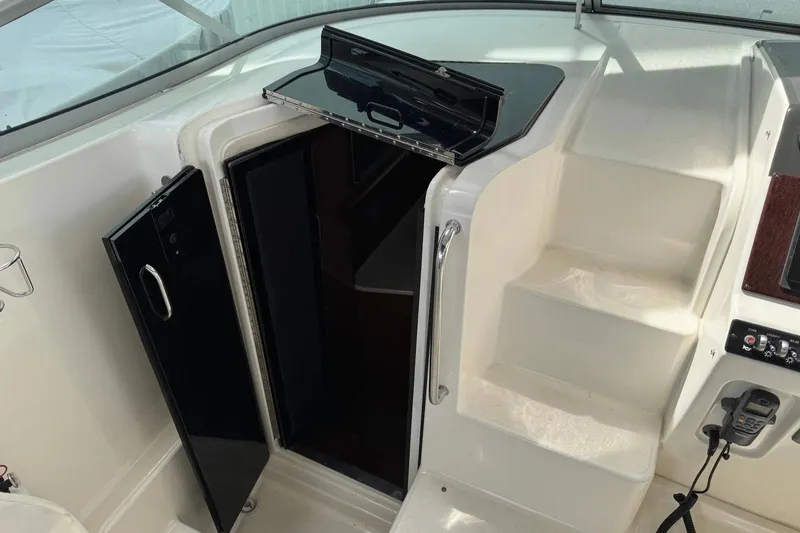 Slide: The Image of 2010 Sea Ray Sundancer 310 cabin entrance with open door and steps. - 15