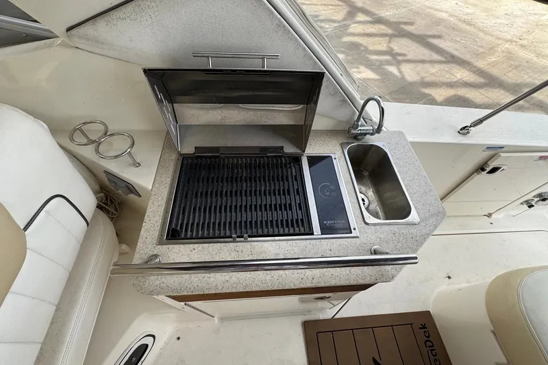 Slide: The Image of Outdoor kitchen on 2010 Sea Ray Sundancer 310 yacht with grill and sink. - 19