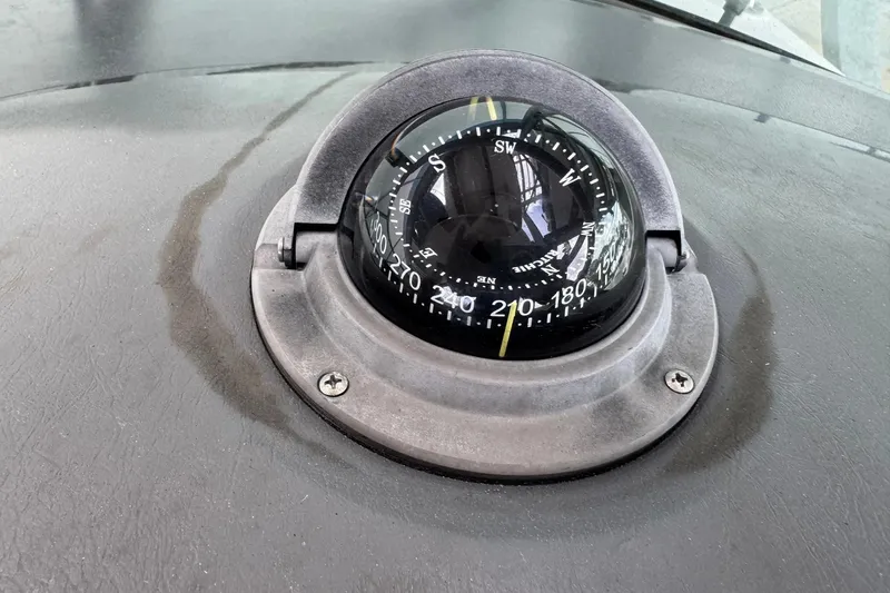 Slide: The Image of Compass on 2010 Sea Ray Sundancer 310 boat dashboard, showing navigation details. - 12