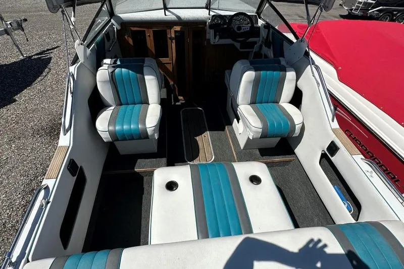 Slide: The Image of Interior of a 1992 Reinell 192 RM boat with blue and white seating. - 5