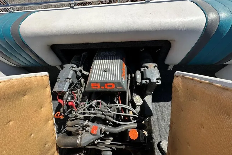 Slide: The Image of Engine compartment of a 1992 Reinell 192 RM boat with a 5.0-liter OMC engine. - 9