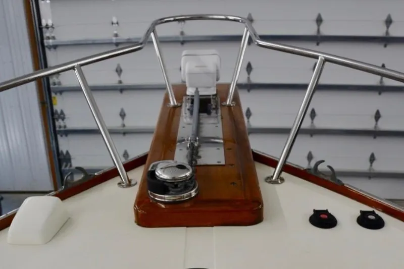 Slide: The Image of Bow view of 1988 Bunker and Ellis 24 Open boat in a garage. - 34