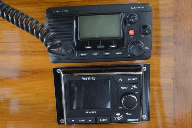 Slide: The Image of Garmin VHF 100 and Infinity PRV-515 radio on Bunker and Ellis 24 Open, 1988 model. - 24
