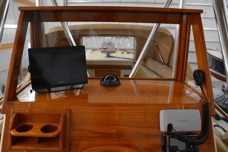 Slide: The Image of 1988 Bunker and Ellis 24 Open boat dashboard with navigation equipment and wooden finish. - 14