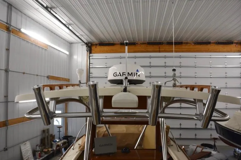 Slide: The Image of 1988 Bunker and Ellis 24 Open boat with Garmin equipment in a garage. - 23