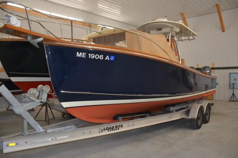 Slide: The Image of 1988 Bunker and Ellis 24 Open boat on trailer in indoor storage. - 8