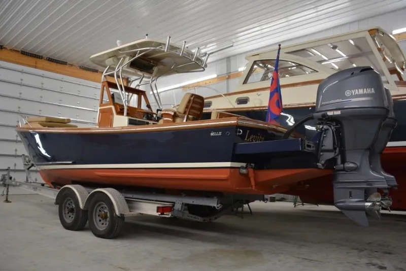 Slide: The Image of 1988 Bunker and Ellis 24 Open boat with Yamaha engine on trailer in garage. - 2