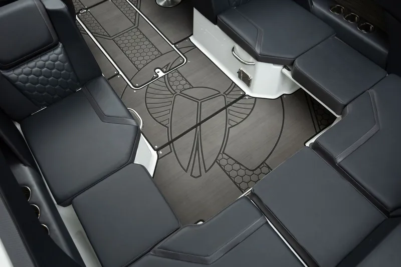 Slide: The Image of Interior of the Scarab 255 LX with stylish upholstered seating and a unique floor pattern. - 9