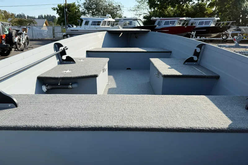 Slide: The Image of 2025 Smoker Craft Big Fisherman 14 boat interior with seating and storage compartments. - 4