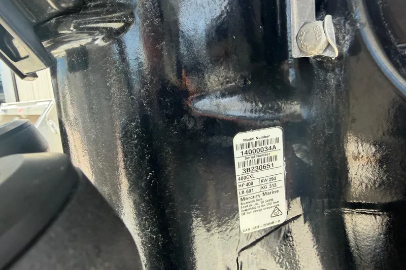 Slide: The Image of Close-up of a 2022 Formula 310 Sun Sport engine label with specifications. - 24