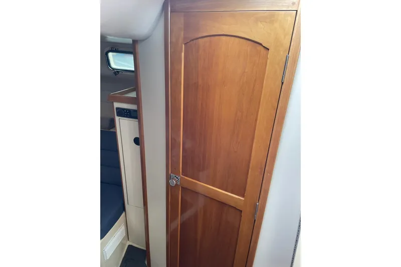 Slide: The Image of Interior view of 2003 Albin 28 Tournament Express with wooden cabin door. - 14