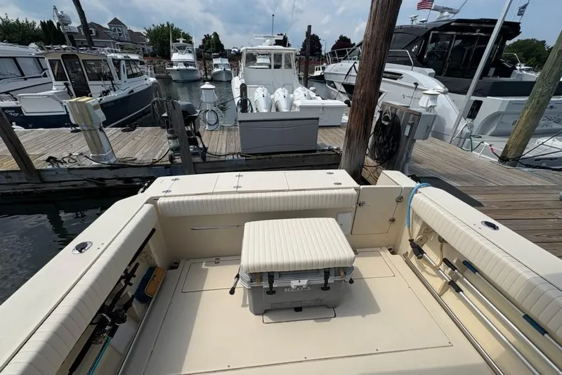 Slide: The Image of 2003 Albin 28 Tournament Express docked at a marina with other boats. - 30
