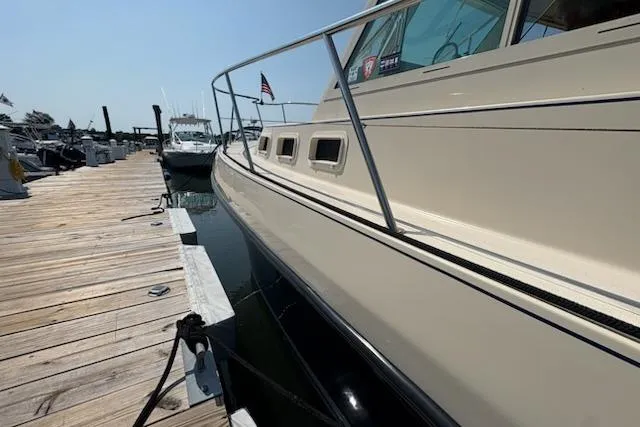 Slide: The Image of 2003 Albin 28 Tournament Express docked at a marina, side view. - 5