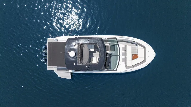 Slide: The Image of Top view of 2021 Cruisers Yachts 38 GLS on calm blue water. - 3