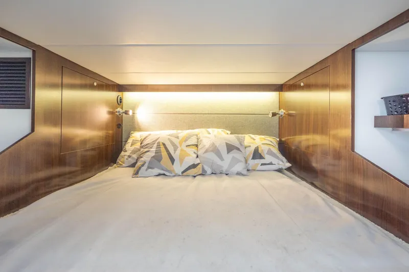 Slide: The Image of Luxurious cabin interior of 2021 Cruisers Yachts 38 GLS with modern bedding. - 37