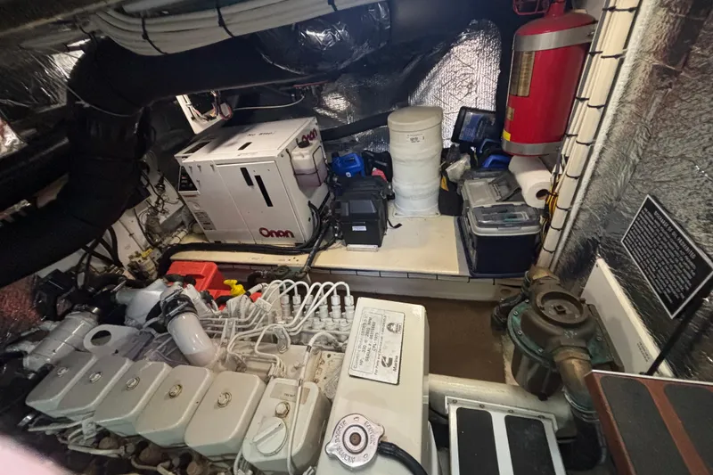Slide: The Image of Engine room of a 2004 Nordic Tug 37 with Onan generator and fire extinguisher. - 24