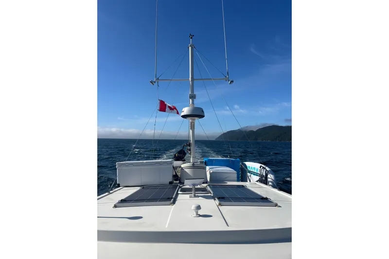 Slide: The Image of Nordic Tug 37 (2004) cruising on open water with clear blue skies. - 3