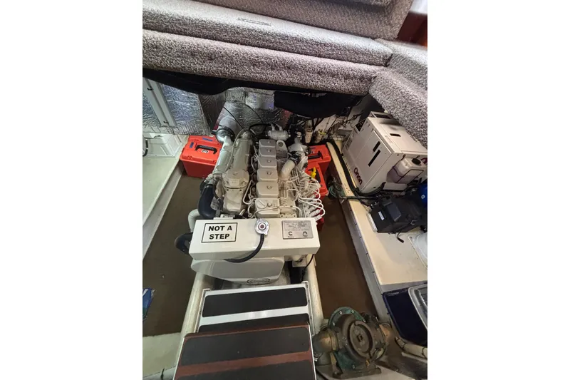 Slide: The Image of Engine room of a 2004 Nordic Tug 37, featuring machinery and equipment. - 23