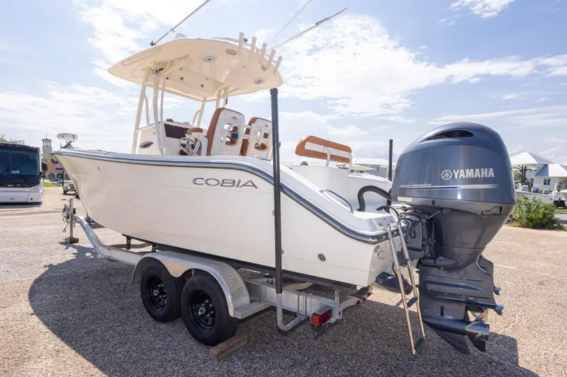 Slide: The Image of 2017 Cobia 261 Center Console boat on trailer with Yamaha outboard motor. - 18