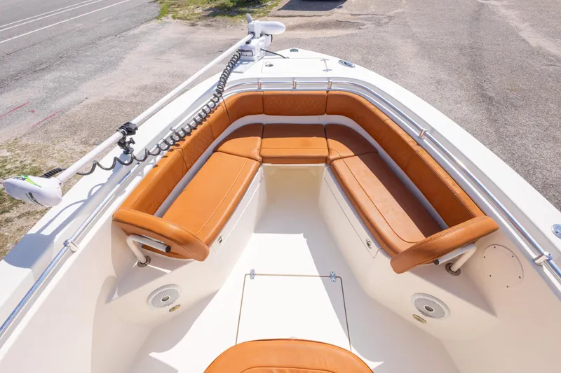 Slide: The Image of 2017 Cobia 261 Center Console boat with tan seating and spacious deck. - 29