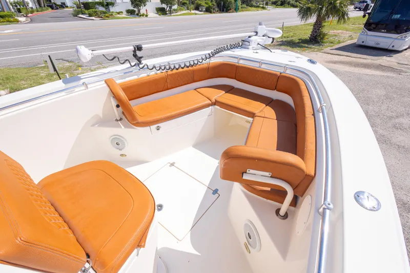 Slide: The Image of 2017 Cobia 261 Center Console boat with tan seating and spacious deck layout. - 28