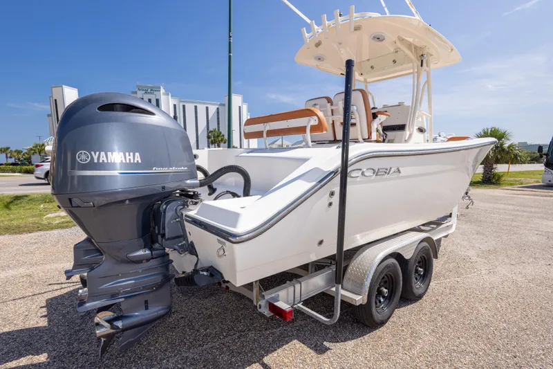 Slide: The Image of 2017 Cobia 261 Center Console boat with Yamaha engine on trailer. - 16
