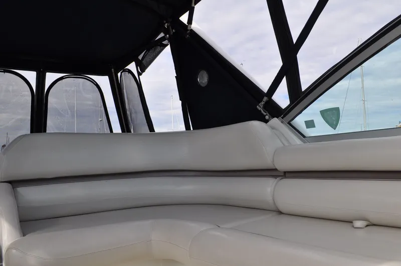 Slide: The Image of The image shows the cockpit of a 1999 Doral 350sc with white leather seating. - 9