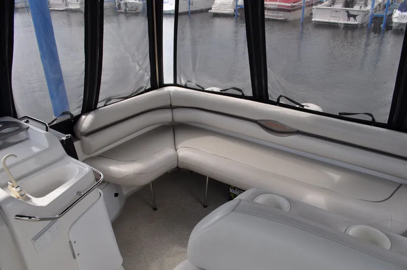 Slide: The Image of The image shows the cockpit of a 1999 Doral 350sc with white cushioned seating and a sink. - 10
