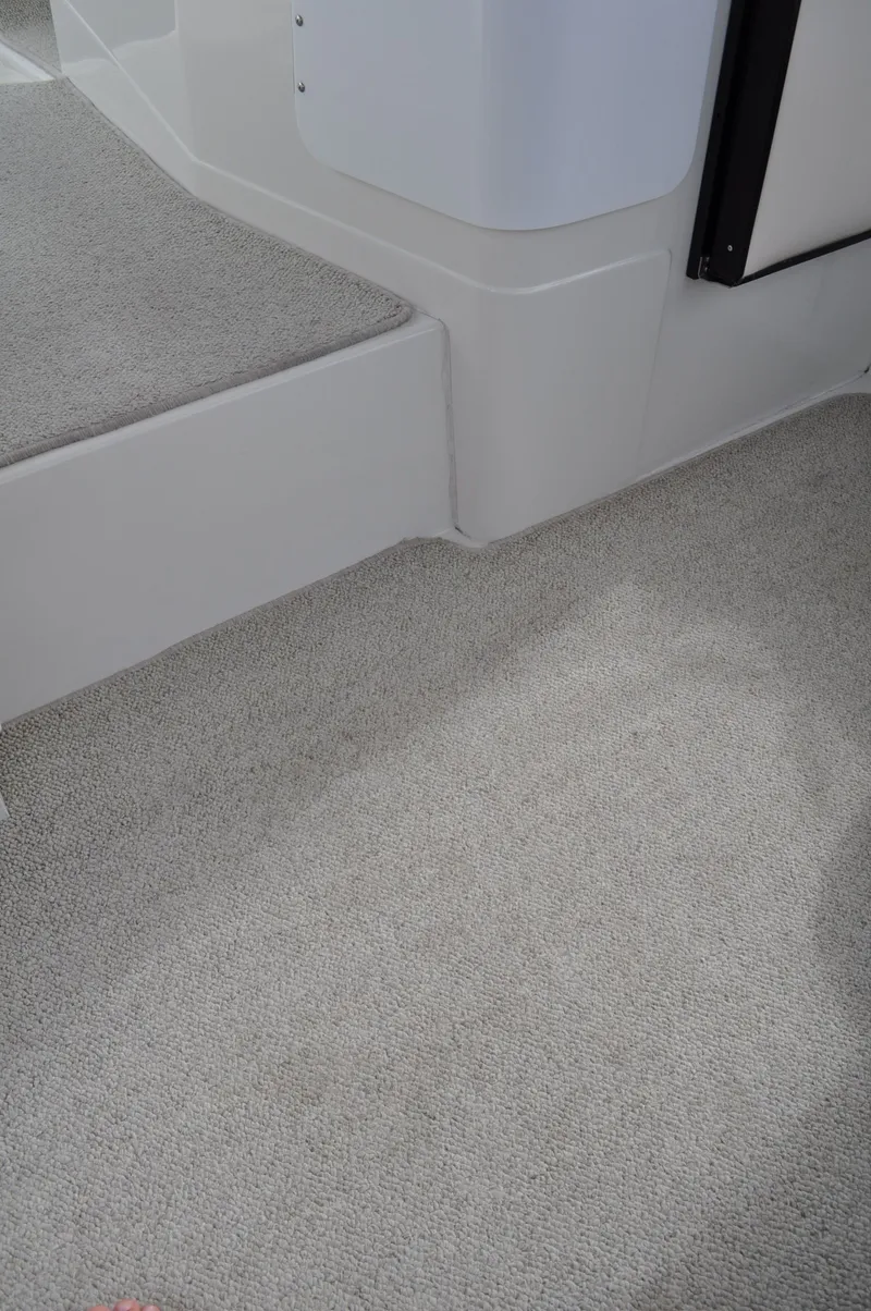 Slide: The Image of Close-up of a boat carpet with gray texture and white steps. - 15
