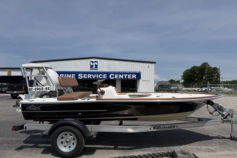 Slide: The Image of 2012 Chaos 16 Bonefish boat on trailer at marine service center. - 6