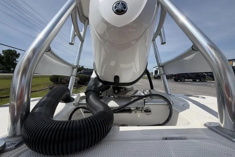 Slide: The Image of 2012 Chaos 16 Bonefish boat engine close-up with metal framework and hoses. - 13