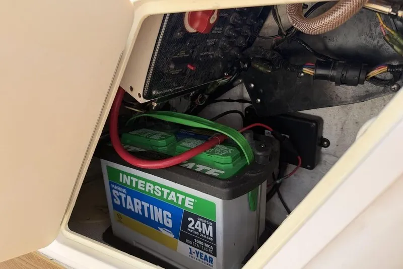 Slide: The Image of Battery compartment of a 2012 Chaos 16 Bonefish boat with Interstate marine battery. - 10