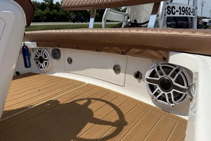 Slide: The Image of 2012 Chaos 16 Bonefish boat interior with speakers and Yamaha keychain. - 18
