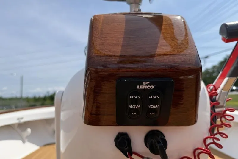 Slide: The Image of Control panel on a 2012 Chaos 16 Bonefish boat with Lenco trim tab switches. - 16