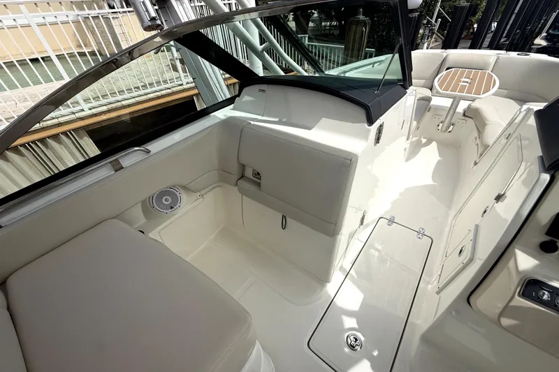 Slide: The Image of 2018 Boston Whaler 230 Vantage boat interior with seating and table, showcasing luxury design. - 10